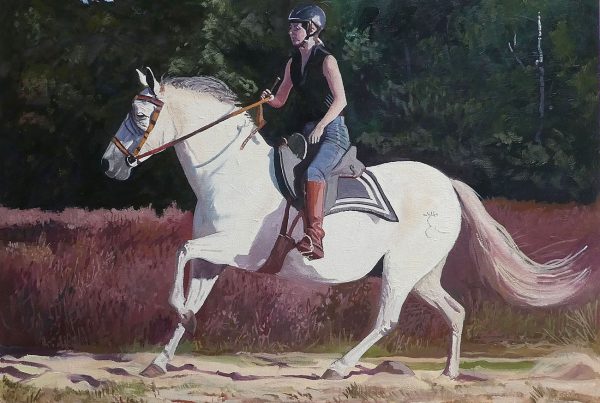 Alicia riding her Spanish horse Cantor.